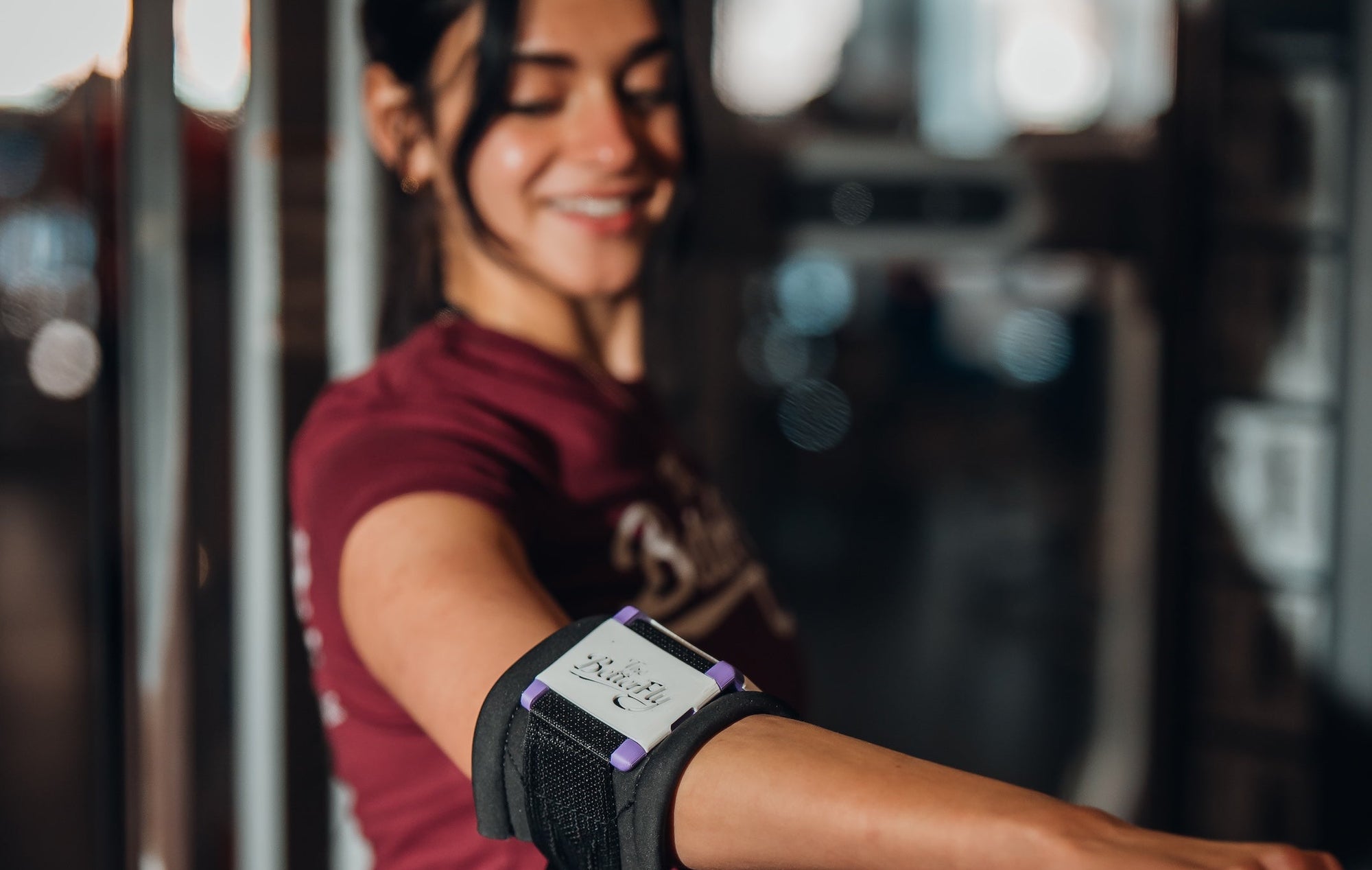 Woman using a smartwatch in a gym setting
