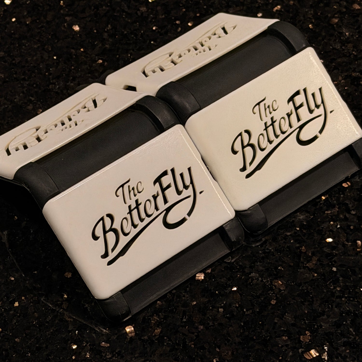 Two 'The BetterFly' devices on a dark background
